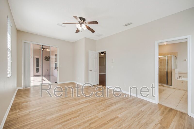 Gorgeous 4/2 in Apopka with Solar Panels and large fence enclosed yard!  Available Now! property image