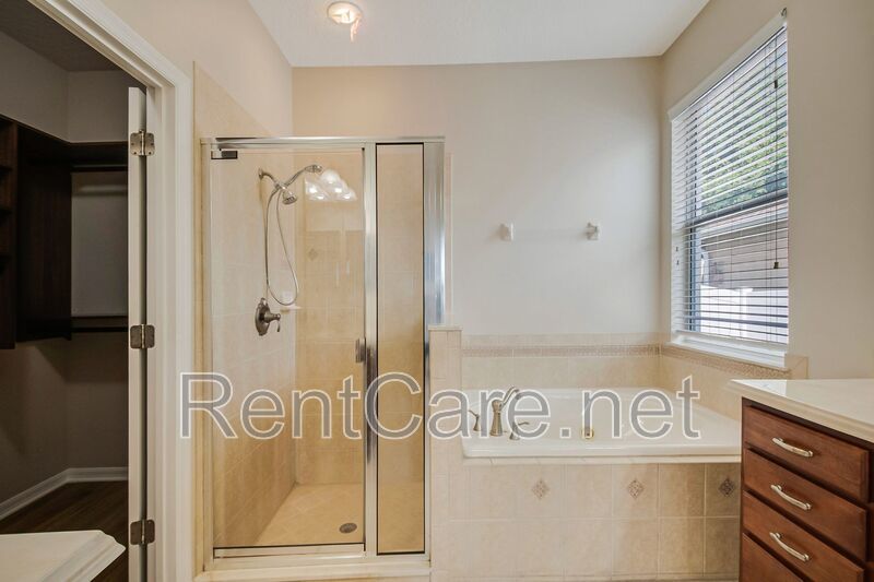 Gorgeous 4/2 in Apopka with Solar Panels and large fence enclosed yard!  Available Now! property image