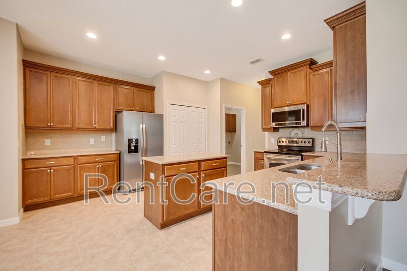 Gorgeous 4/2 in Apopka with Solar Panels and large fence enclosed yard!  Available Now! property image