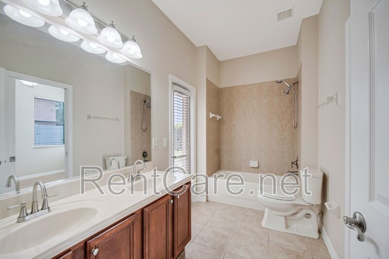 Gorgeous 4/2 in Apopka with Solar Panels and large fence enclosed yard!  Available Now! property image