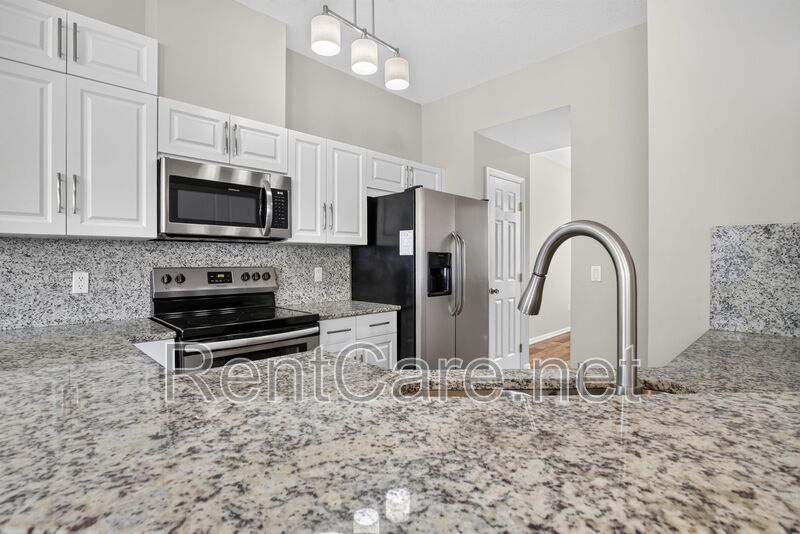 Stunning 3/2.5 corner townhome in Lake Reams with 2 car garage! Available Now! property image