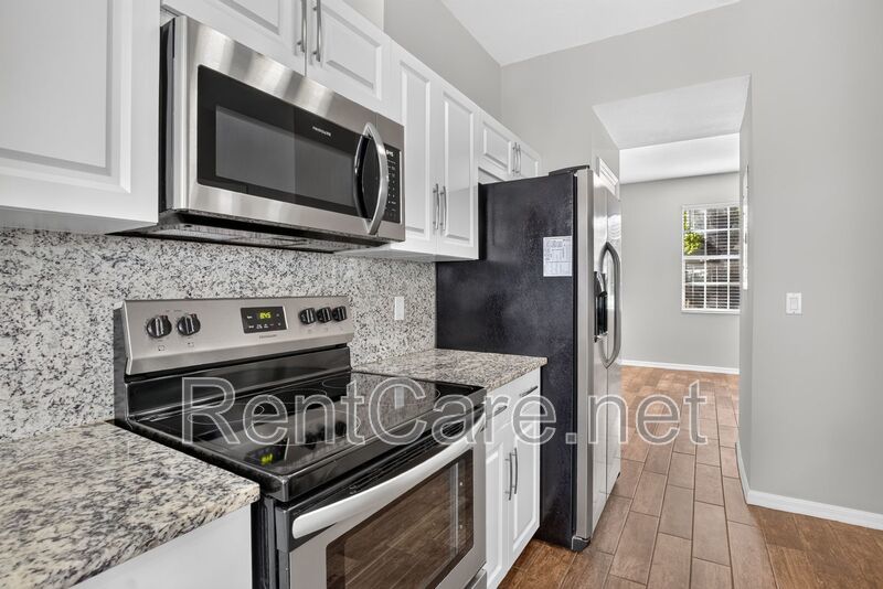 Stunning 3/2.5 corner townhome in Lake Reams with 2 car garage! Available Now! property image