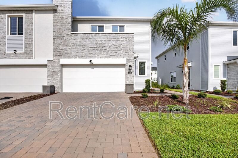 Stunning modern town home in Champions Gate with fence enclosed yard! property image