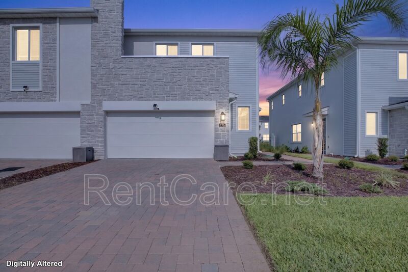 Stunning modern town home in Champions Gate with fence enclosed yard! property image