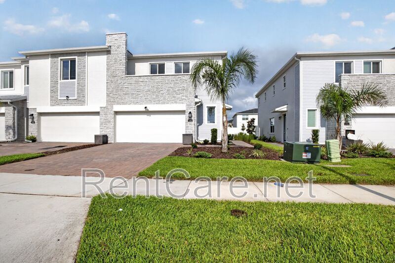 Stunning modern town home in Champions Gate with fence enclosed yard! property image