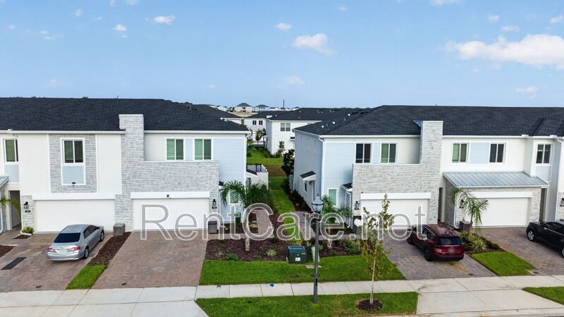 Stunning modern town home in Champions Gate with fence enclosed yard! property image