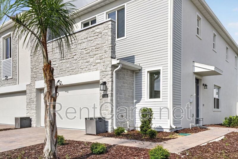 Stunning modern town home in Champions Gate with fence enclosed yard! property image