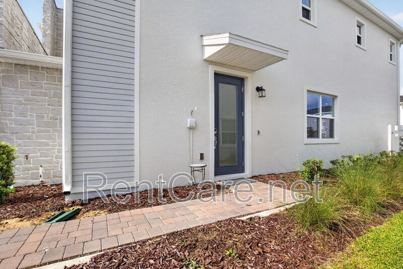 Stunning modern town home in Champions Gate with fence enclosed yard! property image