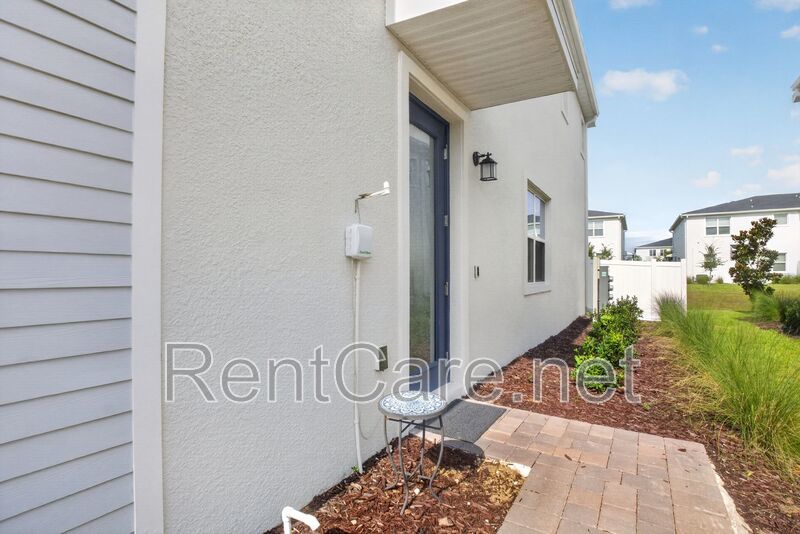 Stunning modern town home in Champions Gate with fence enclosed yard! property image