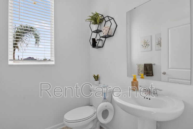 Stunning modern town home in Champions Gate with fence enclosed yard! property image