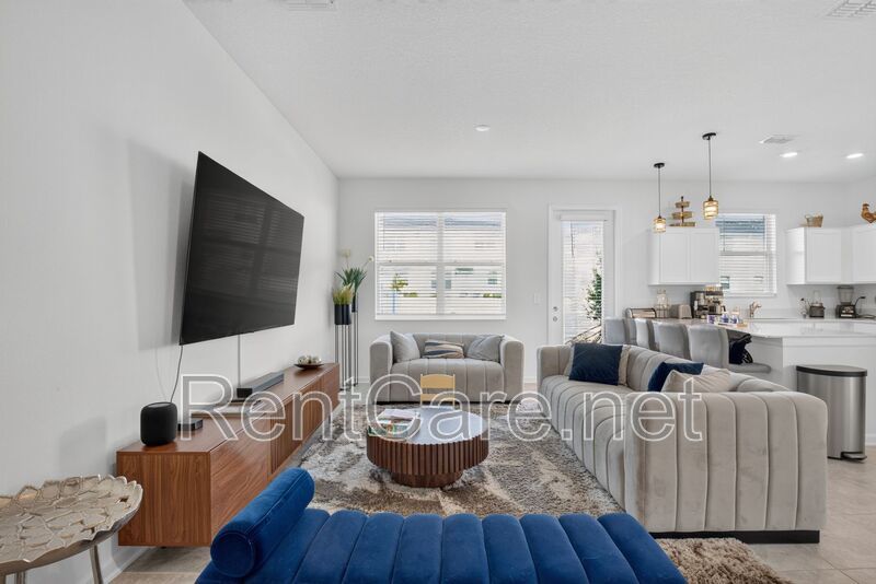Stunning modern town home in Champions Gate with fence enclosed yard! property image