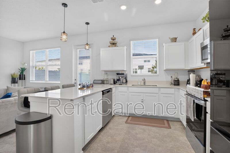 Stunning modern town home in Champions Gate with fence enclosed yard! property image
