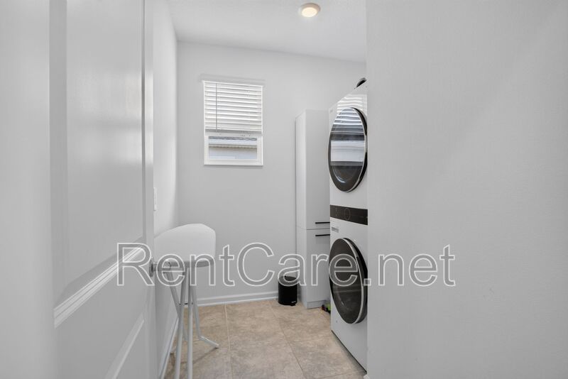 Stunning modern town home in Champions Gate with fence enclosed yard! property image