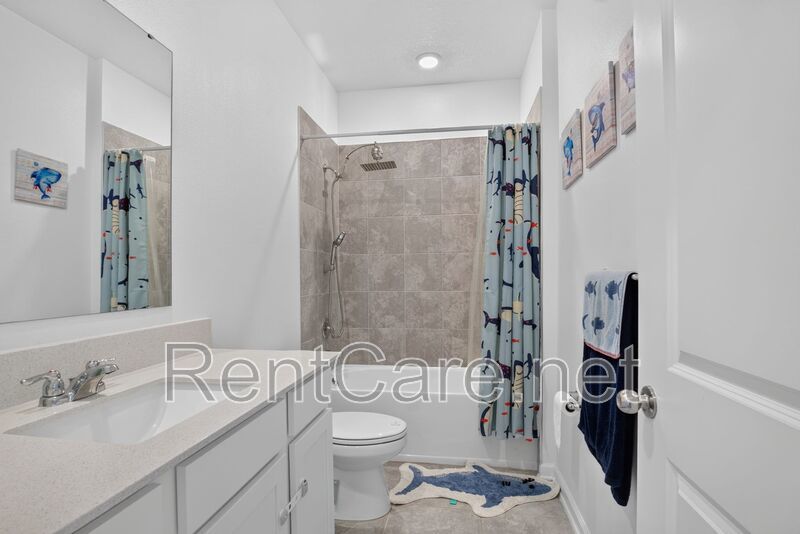 Stunning modern town home in Champions Gate with fence enclosed yard! property image