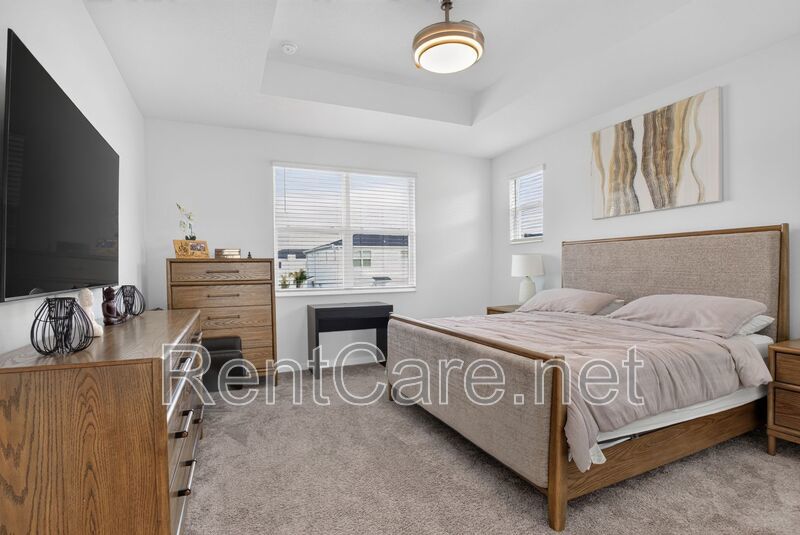 Stunning modern town home in Champions Gate with fence enclosed yard! property image