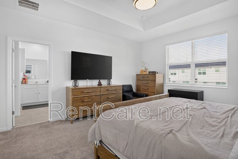 Stunning modern town home in Champions Gate with fence enclosed yard! property image