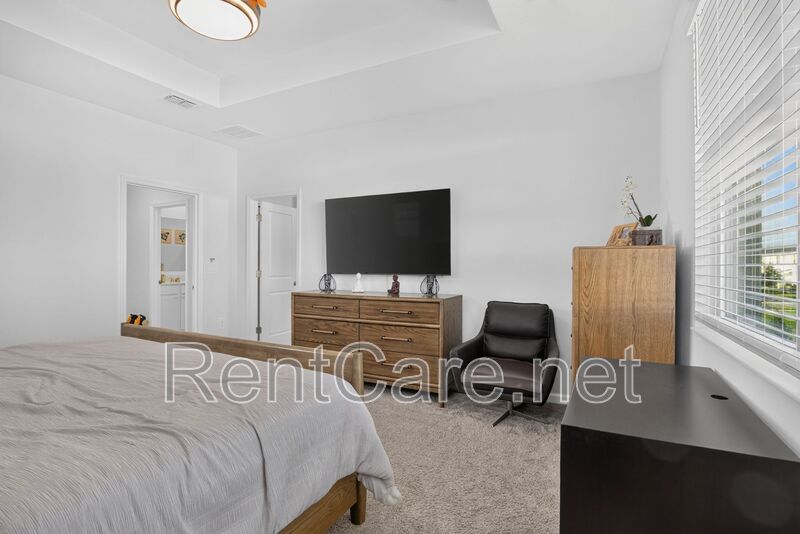 Stunning modern town home in Champions Gate with fence enclosed yard! property image