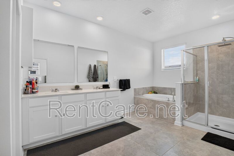 Stunning modern town home in Champions Gate with fence enclosed yard! property image