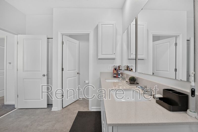 Stunning modern town home in Champions Gate with fence enclosed yard! property image