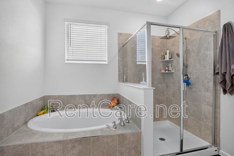Stunning modern town home in Champions Gate with fence enclosed yard! property image