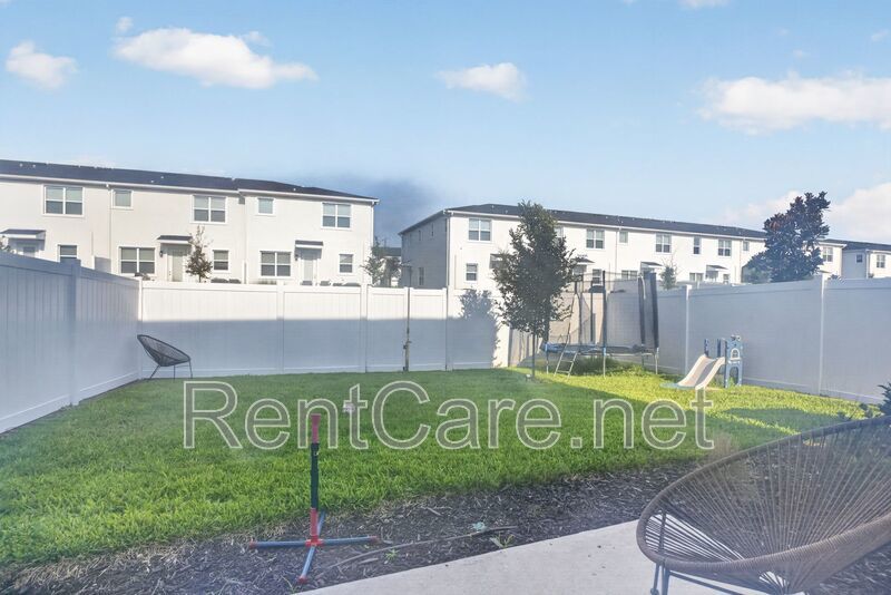 Stunning modern town home in Champions Gate with fence enclosed yard! property image