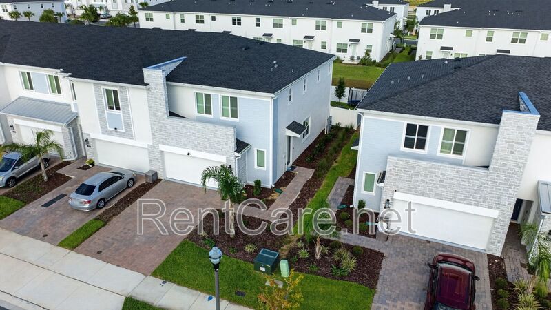 Stunning modern town home in Champions Gate with fence enclosed yard! property image