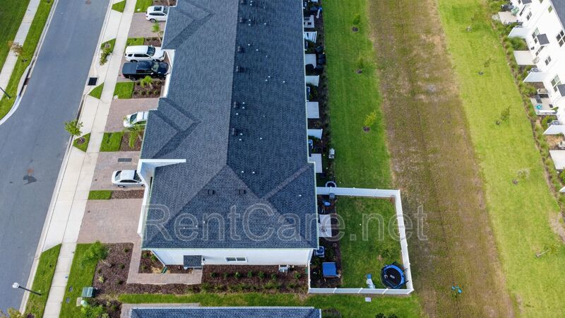 Stunning modern town home in Champions Gate with fence enclosed yard! property image