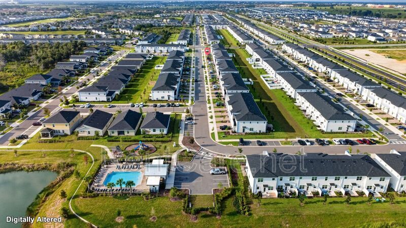 Stunning modern town home in Champions Gate with fence enclosed yard! property image