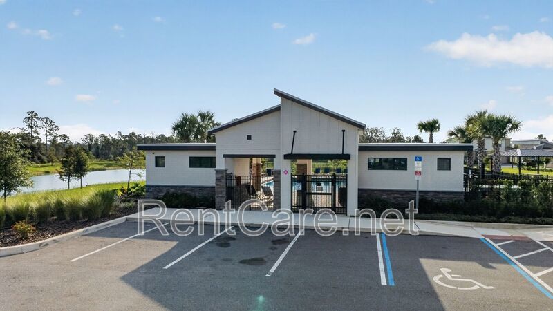 Stunning modern town home in Champions Gate with fence enclosed yard! property image
