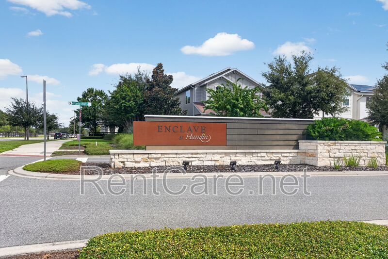Stunning 4/3.5 home with an office and fence enclosed yard! Located at the Enclave at Hamlin and available for immediate occupancy! property image