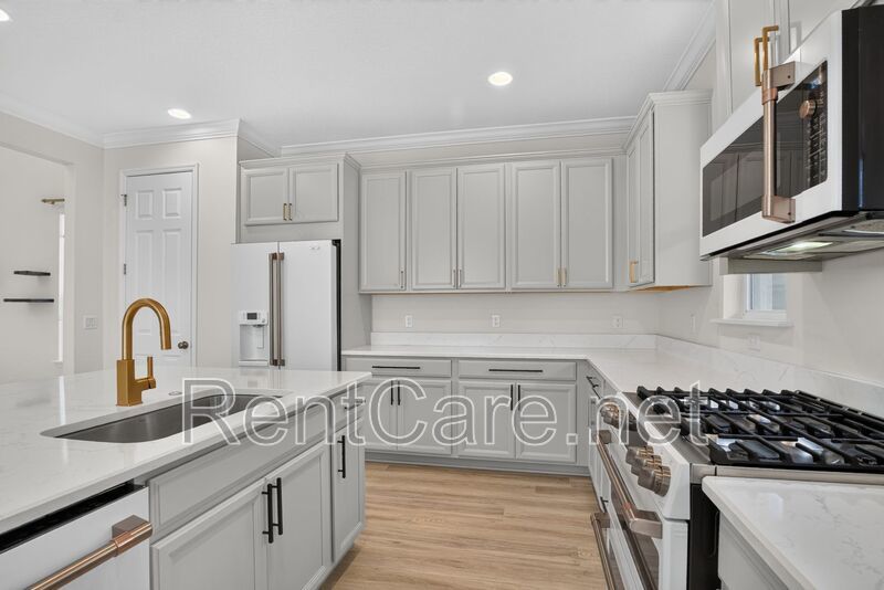 Stunning 4/3.5 home with an office and fence enclosed yard! Located at the Enclave at Hamlin and available for immediate occupancy! property image