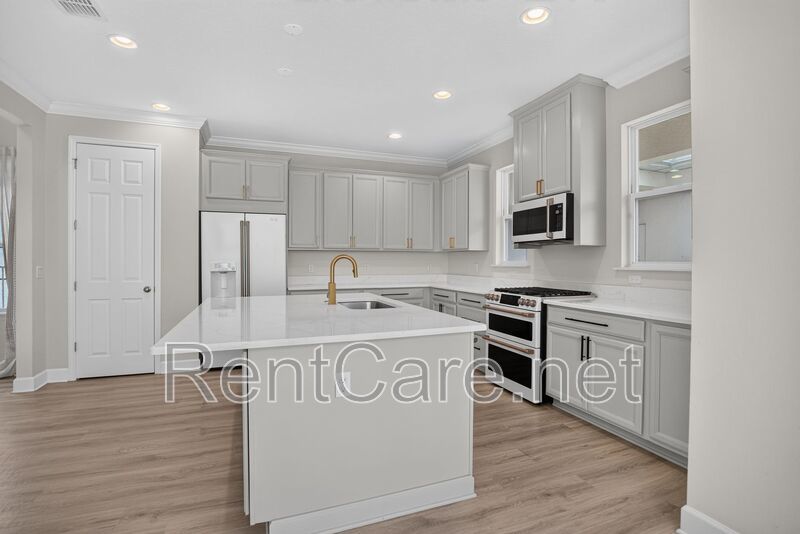 Stunning 4/3.5 home with an office and fence enclosed yard! Located at the Enclave at Hamlin and available for immediate occupancy! property image
