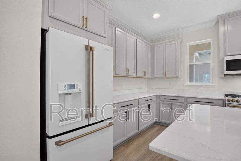Stunning 4/3.5 home with an office and fence enclosed yard! Located at the Enclave at Hamlin and available for immediate occupancy! property image