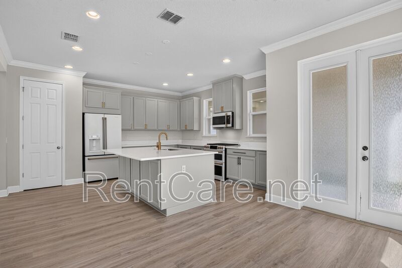 Stunning 4/3.5 home with an office and fence enclosed yard! Located at the Enclave at Hamlin and available for immediate occupancy! property image