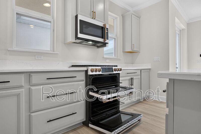Stunning 4/3.5 home with an office and fence enclosed yard! Located at the Enclave at Hamlin and available for immediate occupancy! property image