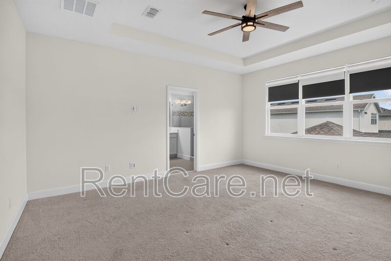Stunning 4/3.5 home with an office and fence enclosed yard! Located at the Enclave at Hamlin and available for immediate occupancy! property image
