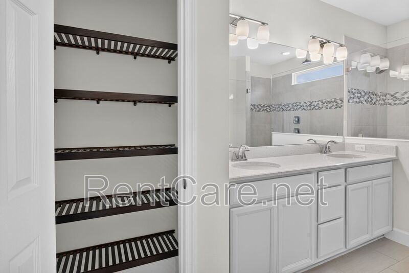Stunning 4/3.5 home with an office and fence enclosed yard! Located at the Enclave at Hamlin and available for immediate occupancy! property image