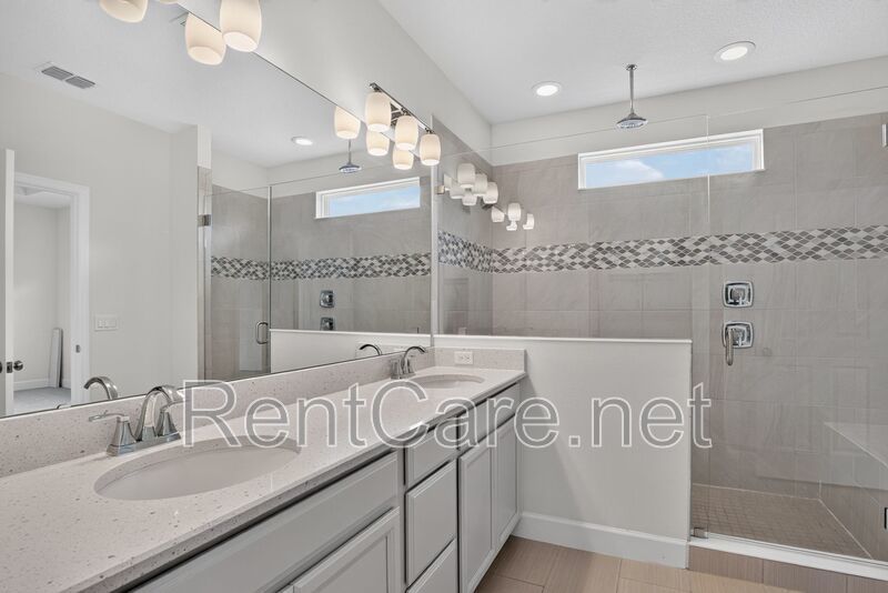 Stunning 4/3.5 home with an office and fence enclosed yard! Located at the Enclave at Hamlin and available for immediate occupancy! property image